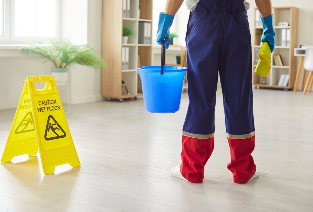 Professional,Cleaning,Worker,,Cleaner,,Janitor,Wearing,Blue,Protective,Rubber,Gloves,